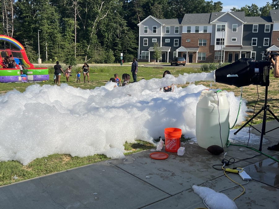 Kids playing in a backyard foam party